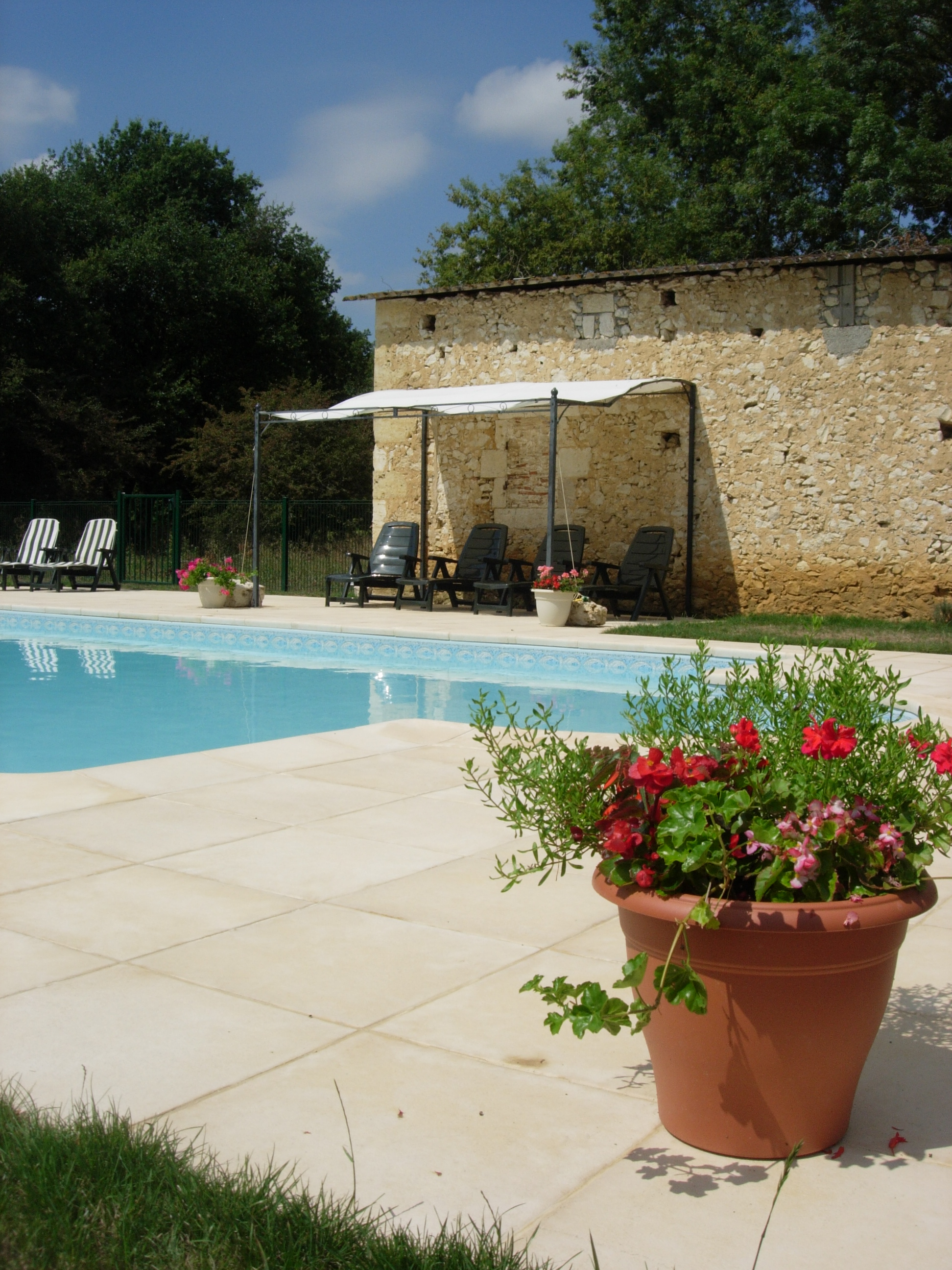 Swimming pool and patio at Barrusclet farmhosue gite